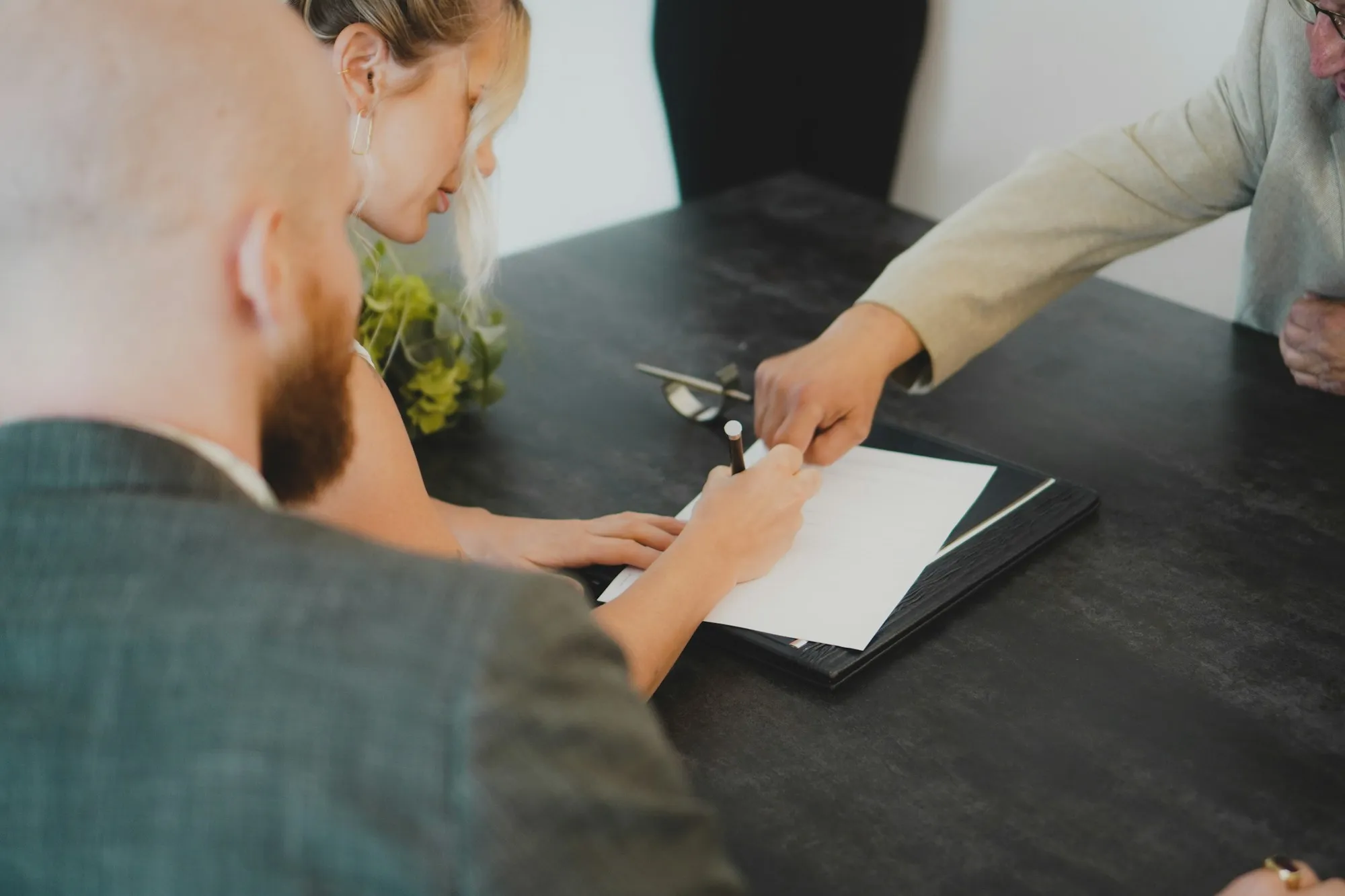 Couple signing their closing documents