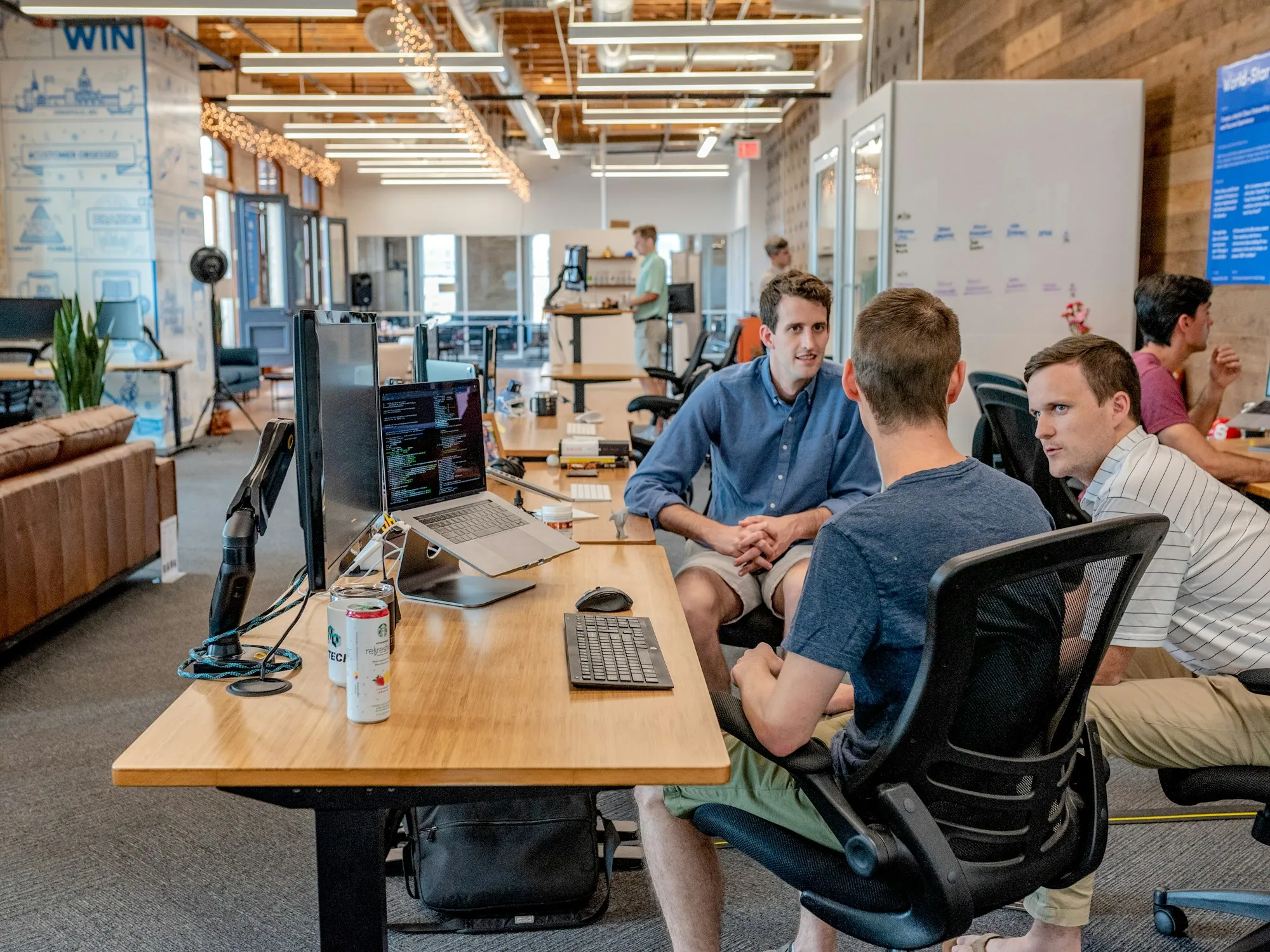 HOMEH team working together in a bright open office