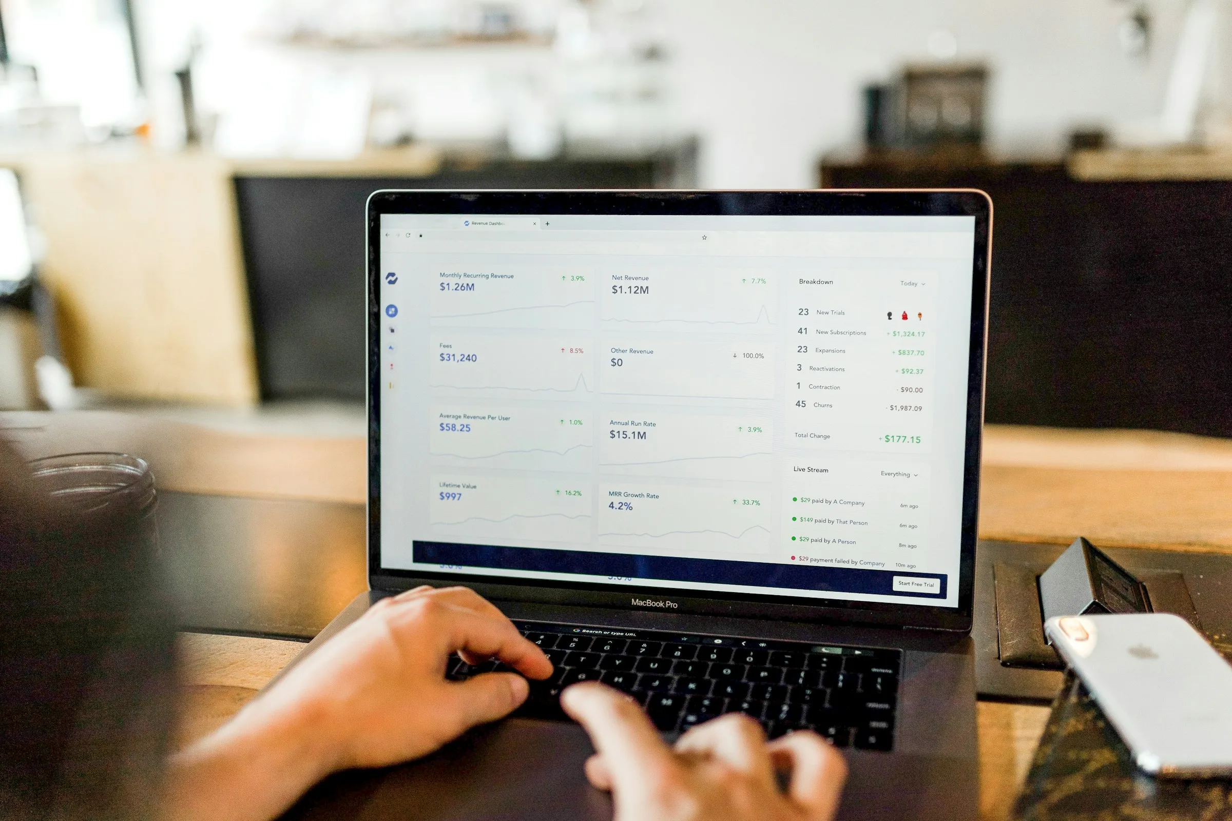 Reviewing live housing market numbers on a laptop dashboard