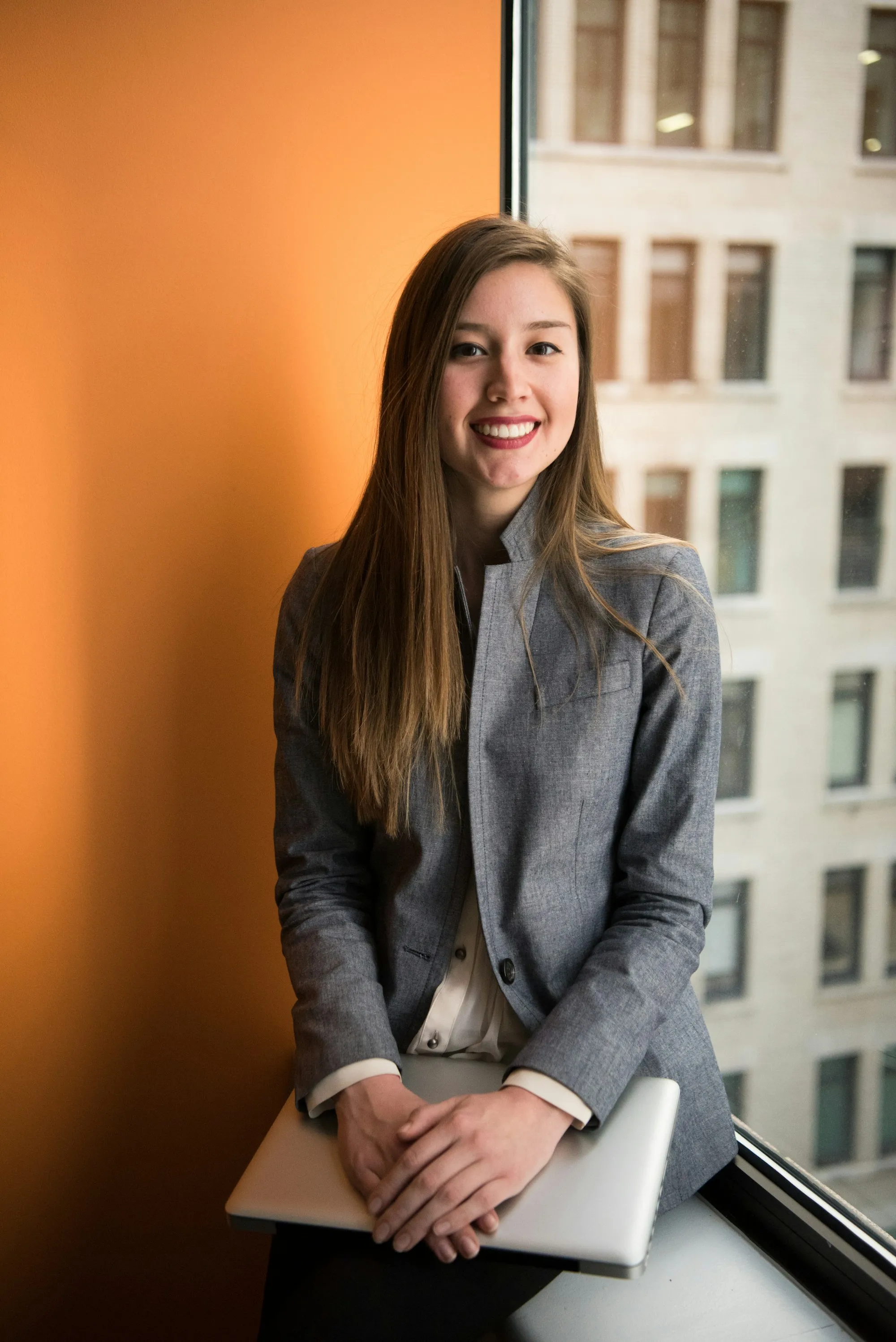 A smiling young professional ready to help you get a mortgage