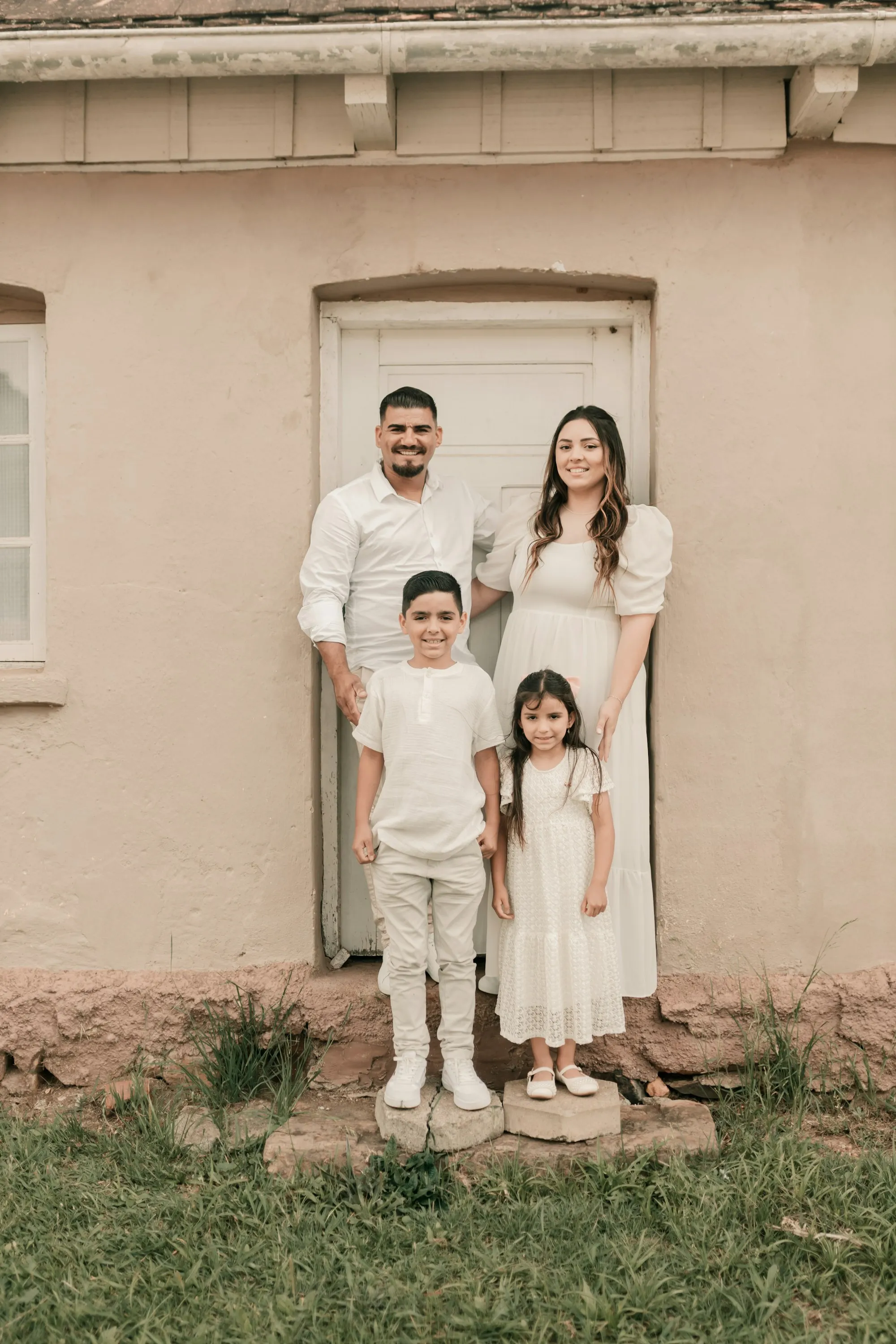 Family in front of their sold home