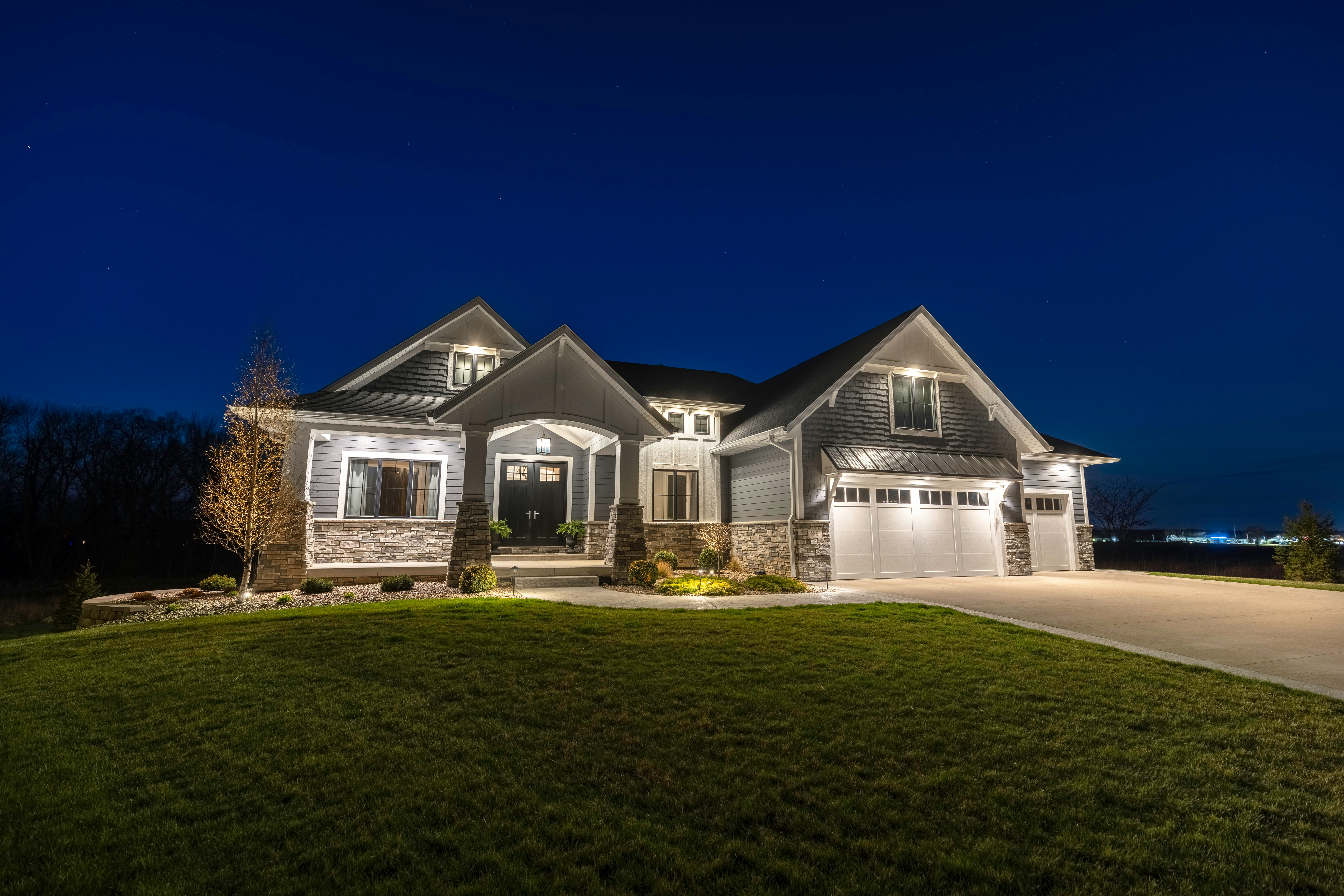Canadian home listed with HOMEH, lit up at dusk